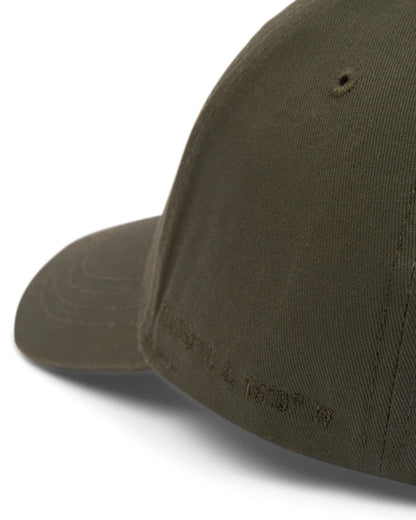 Saltrock adults Dockyard Cap in Dark Green with embroidered Saltrock HQ coordinates on the side.