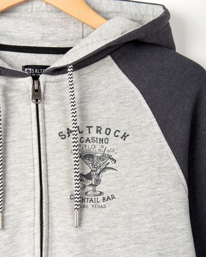 Men's zip through raglan sleeve Vegas Cocktail hoodie from Saltrock in grey with dark grey sleeves and drawstring hood.