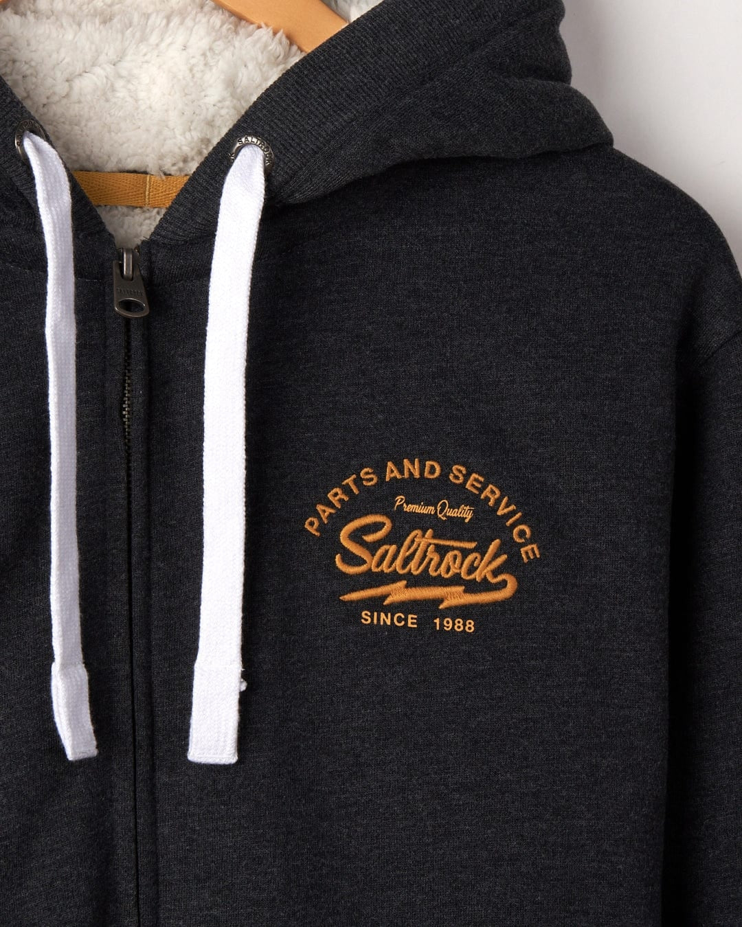 Men's borg lined Vegas Script hoodie from Saltrock in dark grey with logo embroidered on one side of the chest.