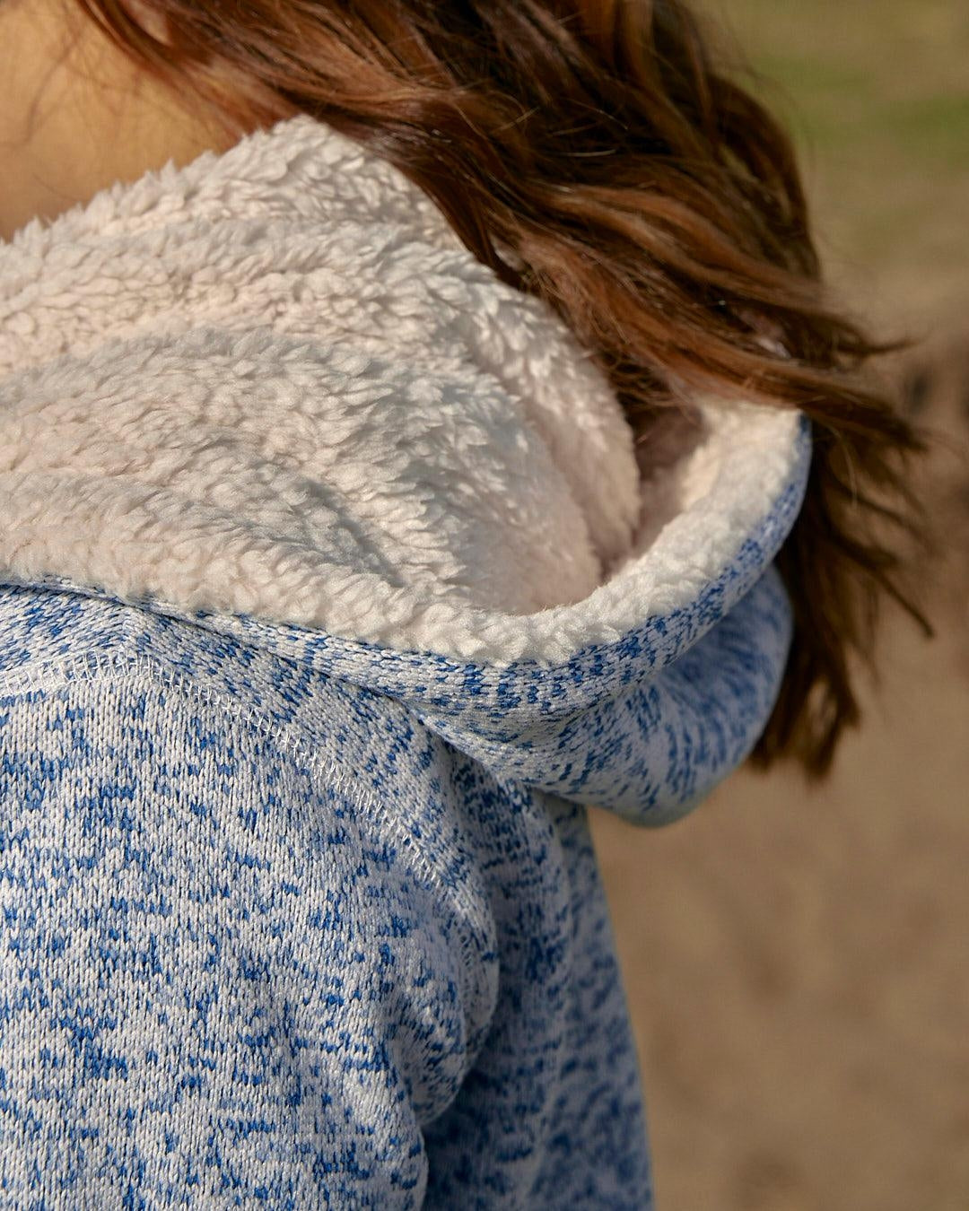 Women's Galak hoodie from Saltrock with knitted outer fabric and fur lining.