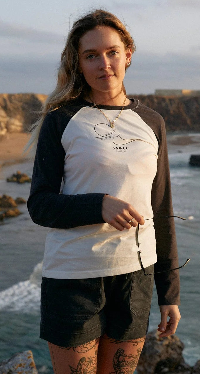 Women's Saltrock long sleeve raglan style t-shirt in white with dark grey sleeves and High Tides print on the chest.