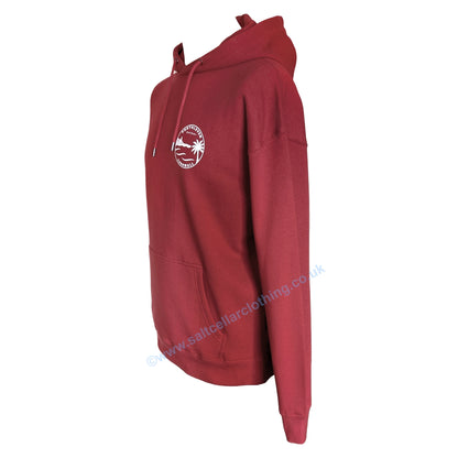 A unisex red popover hoodie shown from the side, featuring a small white circular graphic on the chest with the text 'PORTHLEVEN' 'Salt Cellar' and 'CORNWALL' with the Porthleven harbour and clocktower, waves and a palm tree illustration.