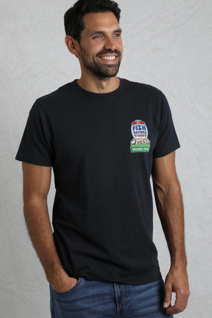 A man wearing a navy Weird Fish short sleeve t-shirt with a rugby themed Six Nations print on a light grey background