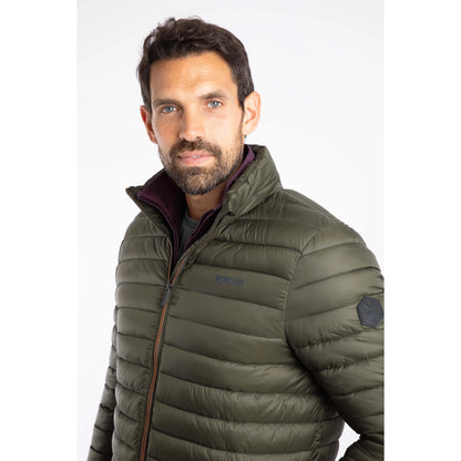 Close-up view of a man wearing a Weird Fish Crantock padded showerproof jacket in Anthracite 
