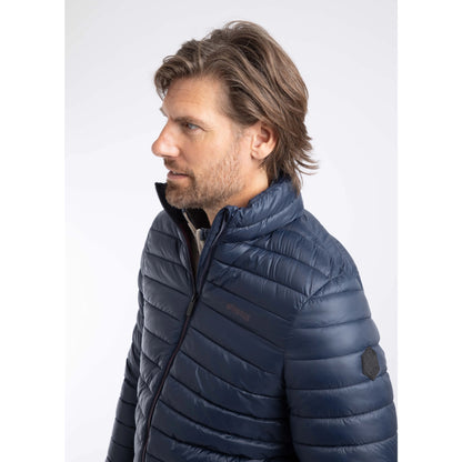 Close-up view of a man wearing a Weird Fish Crantock padded jacket in navy.