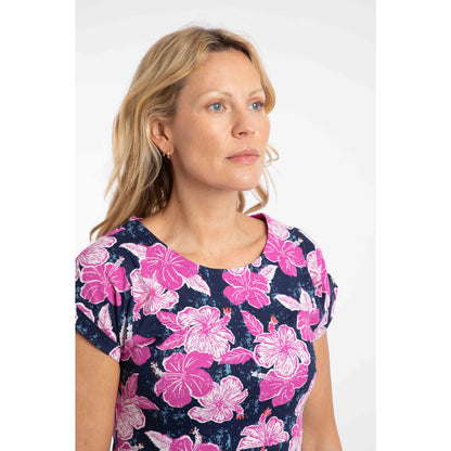 Close-up view of a woman wearing a Weird Fish short sleeve Tallahassee dress in Fuchsia Punch Pink.