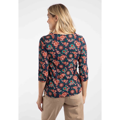 Woman wearing a Weird Fish multicolour floral t-shirt with a white background