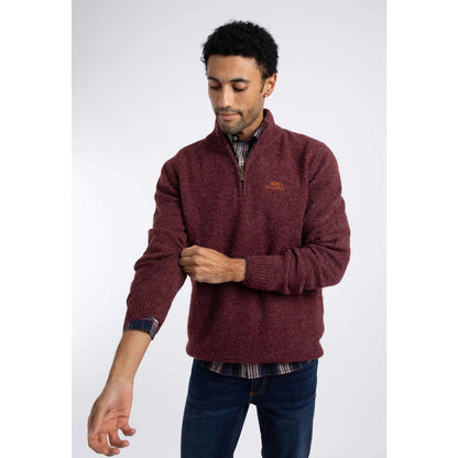 Front view of a man wearing a Weird Fish 1/4 zip Altwood knitted jumper in Garnet Red. over a polo shirt with blue jeans