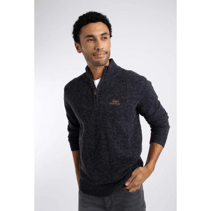 Front view of a man wearing a Weird Fish 1/4 zip Altwood knitted jumper in Midnight Navy.