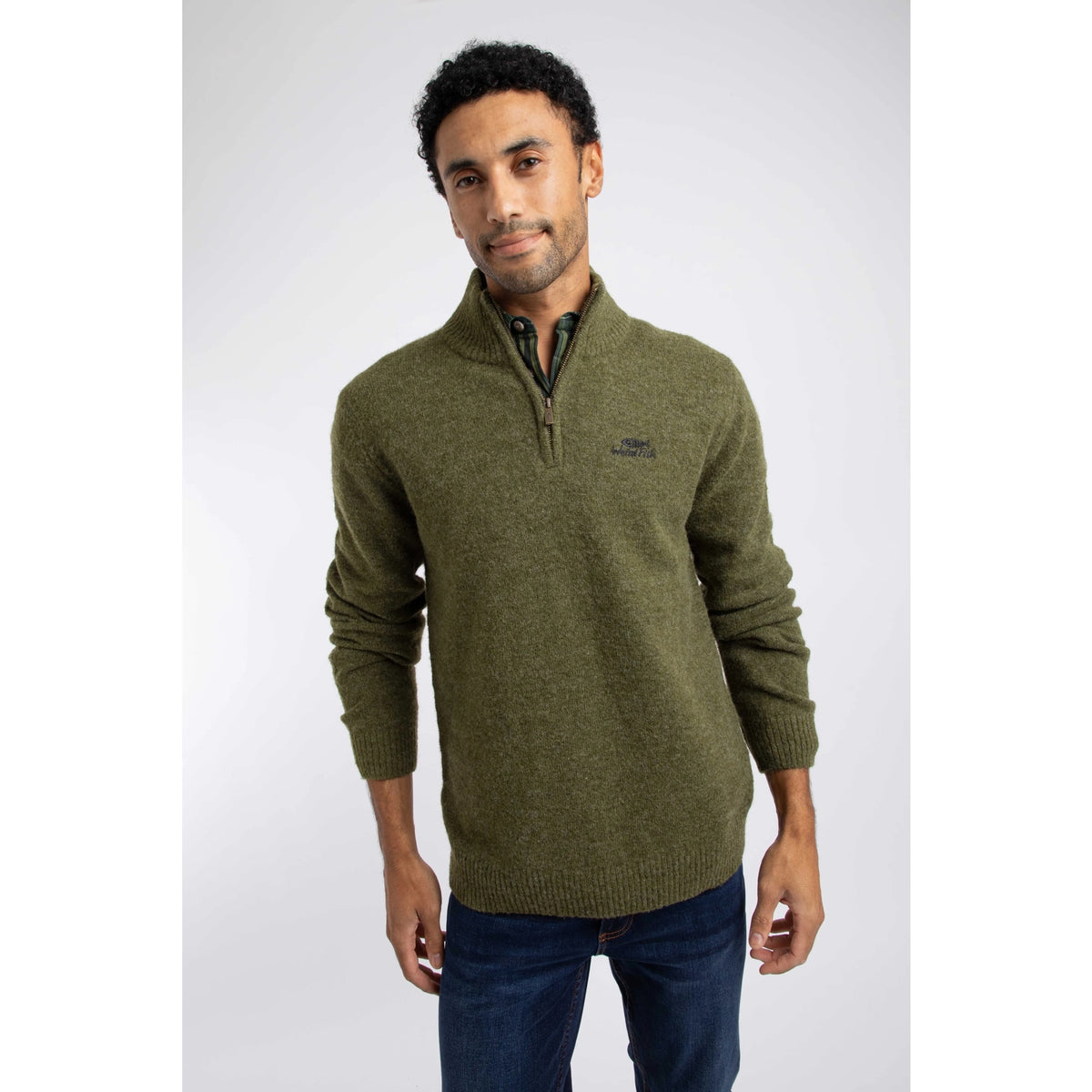 Front view of a man wearing a Weird Fish 1/4 zip Altwood knitted jumper in Winter Green.