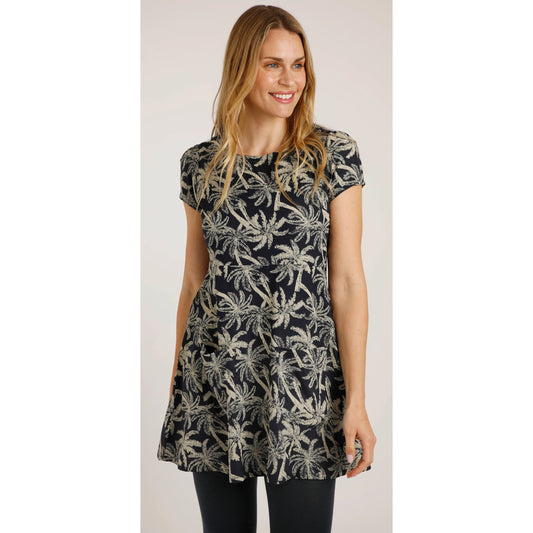 Front view of a woman wearing a Weird Fish short sleeve Breeza tunic in Midnight Navy with a beige palm tree pattern.