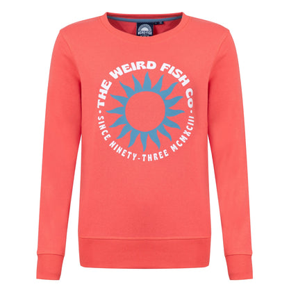 Front view of a Weird Fish women's Aurora crew neck sweatshirt in a bright coral colour with bold circular logo on the front.