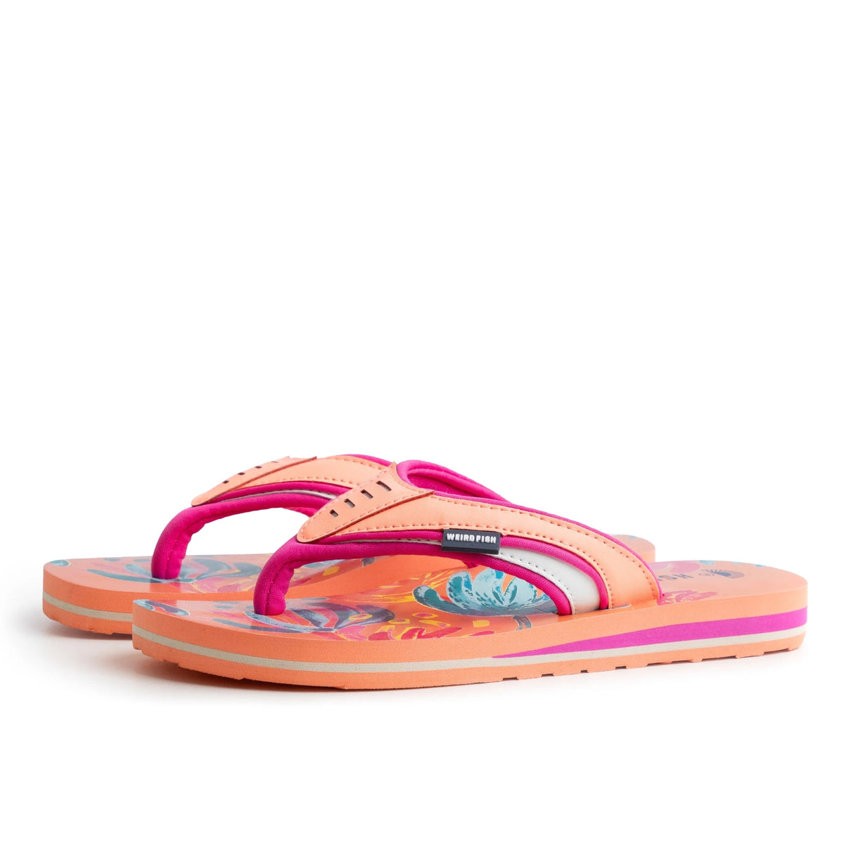 Side view of a pair of Weird Fish women's Thurleston flip flops in Sorbet Orange, with a bright abstract floral pattern on the footbed.