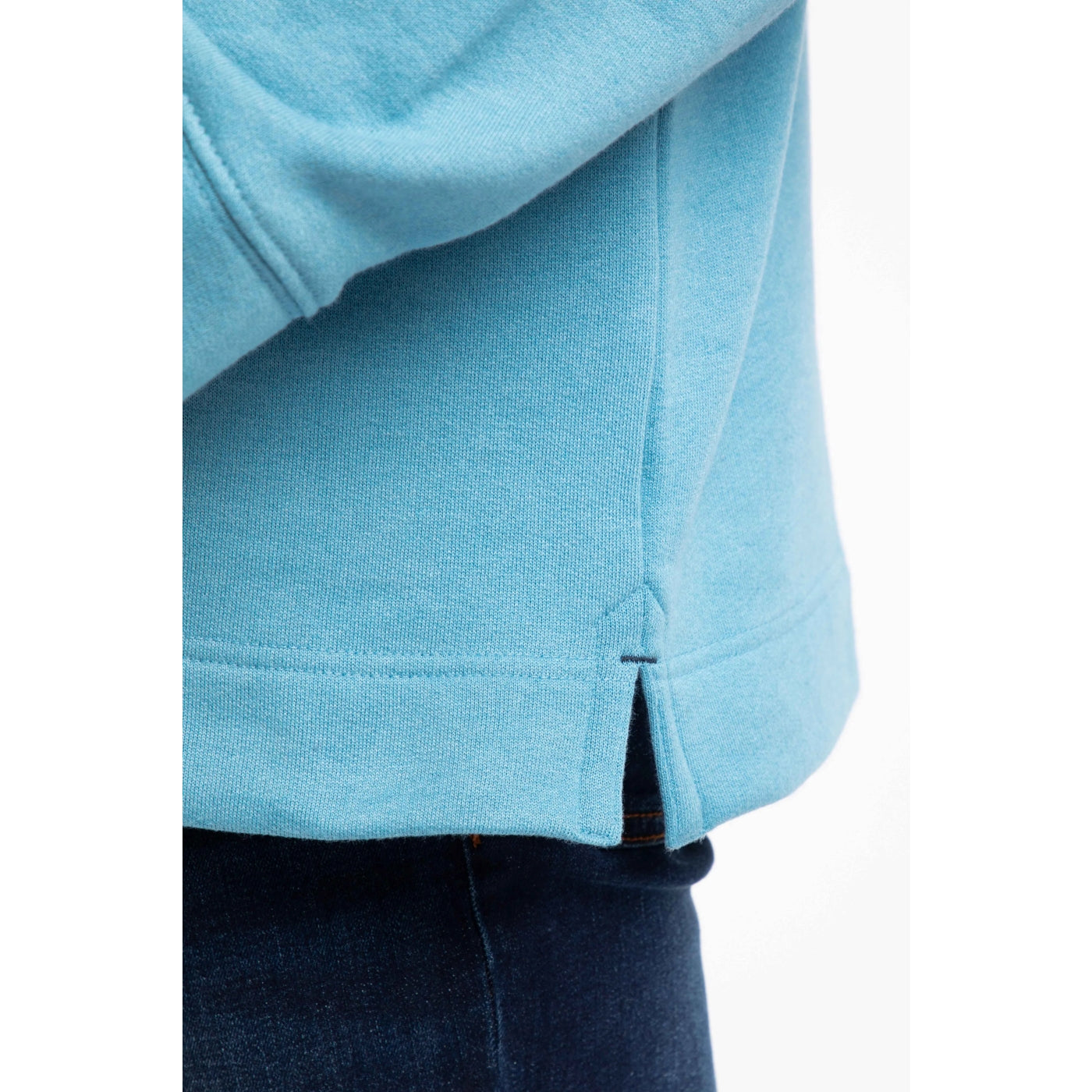 Close-up of a blue sweatshirt with a white background