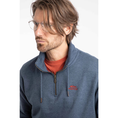 Man wearing a Weird Fish navy blue Brampton pullover sweatshirt with a red logo on a white background