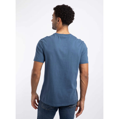Plain black view of a man wearing a Weird Fish 'Carp Side of the Moon' printed short sleeve t-shirt in Ensign Blue.