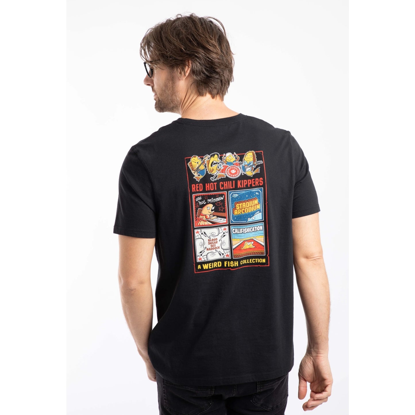 Back view of a man wearing a Weird Fish mens short sleeve Chili Kippers t-shirt in black with a large Red Hot Chili Kippers album themed print on the back