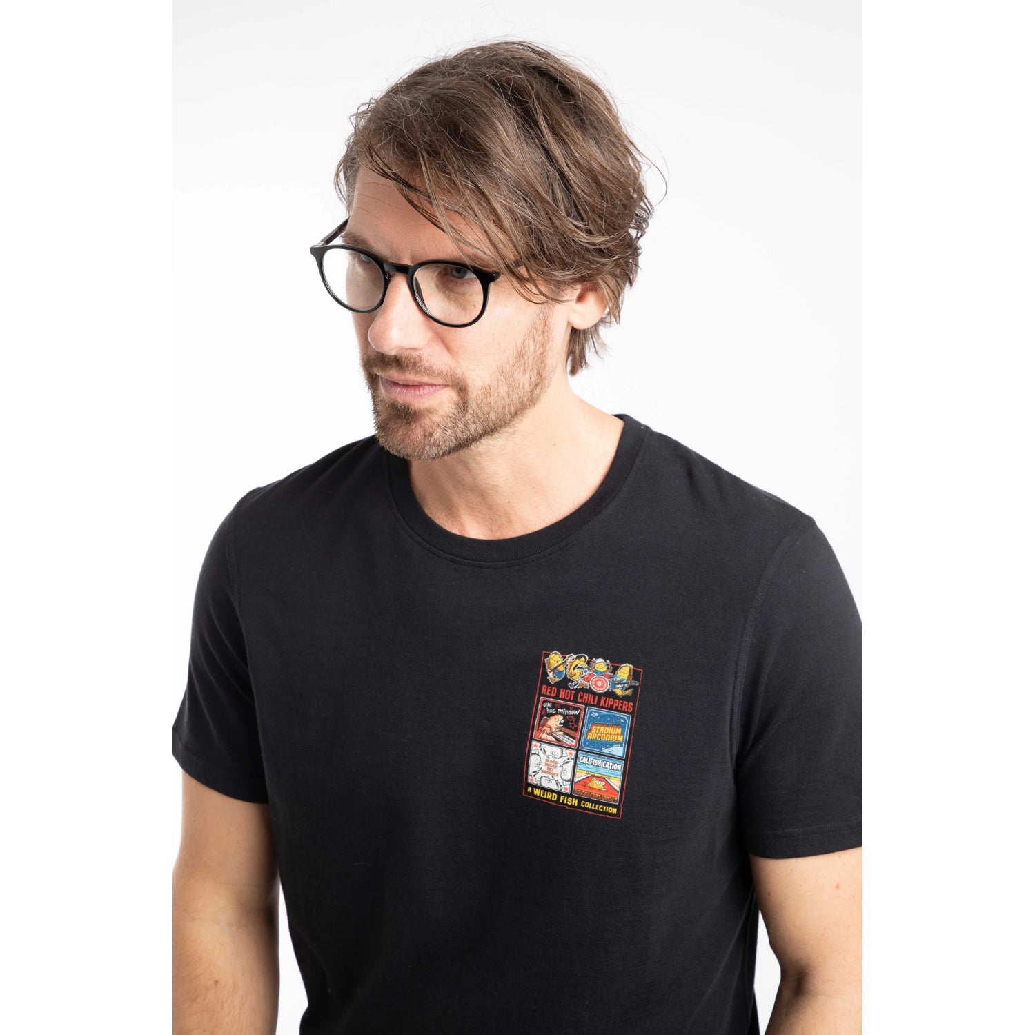 Close-up view of a man wearing a Weird Fish mens short sleeve Chili Kippers t-shirt in black.