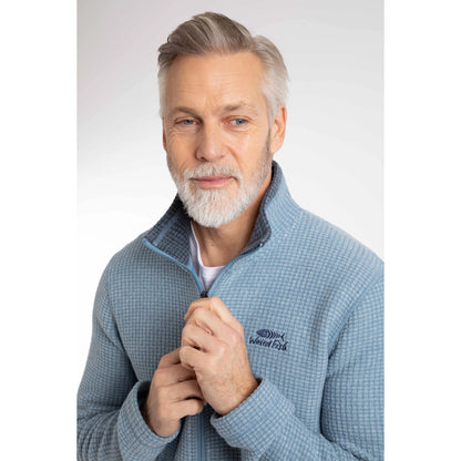 Close-up view of a man wearing a Weird Fish full zip Shires grid textured fleece in Light Blue with contrasting navy neckline and small chest logo