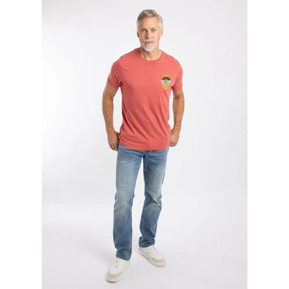 A man wearing a Weird Fish Cod and Chips print short sleeve t-shirt in Nantucket Red with blue jeans and white shoes