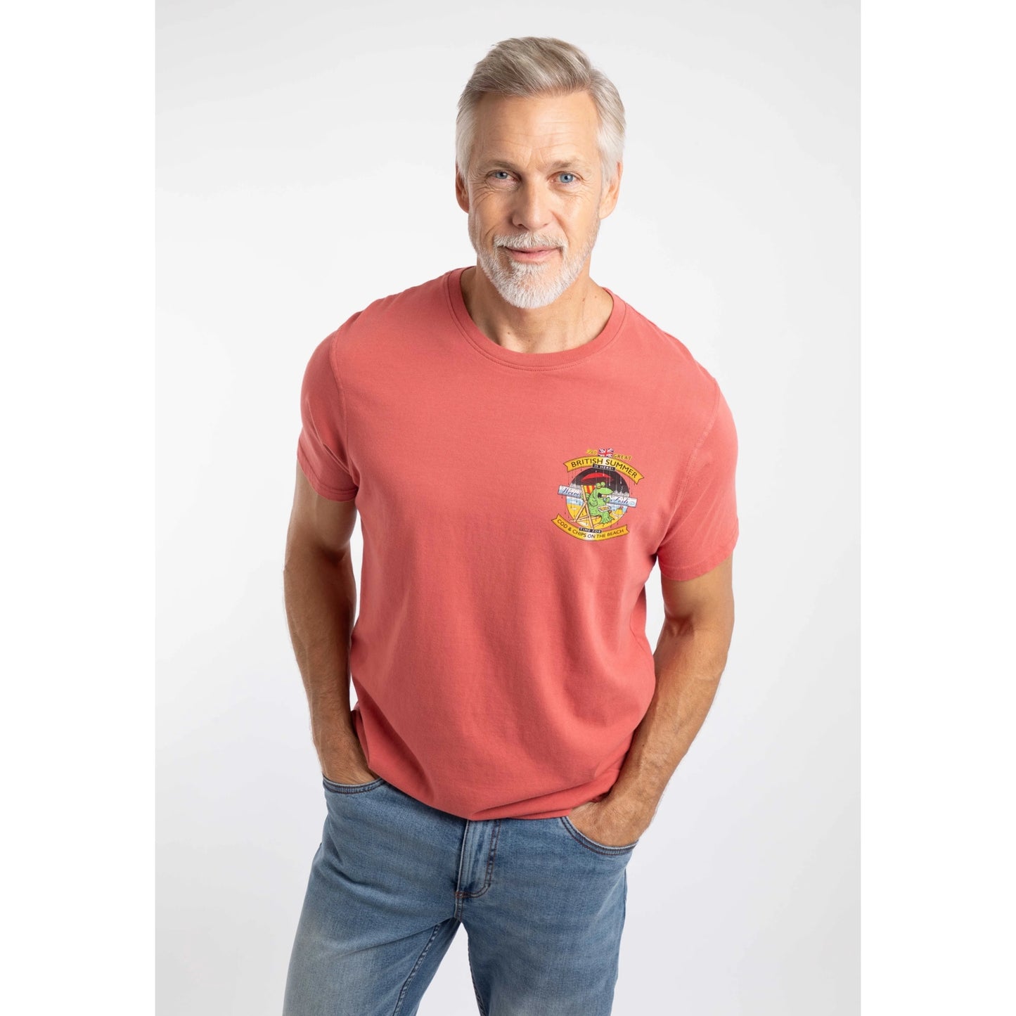 A man wearing a Weird Fish Cod and Chips print short sleeve t-shirt in Nantucket Red.
