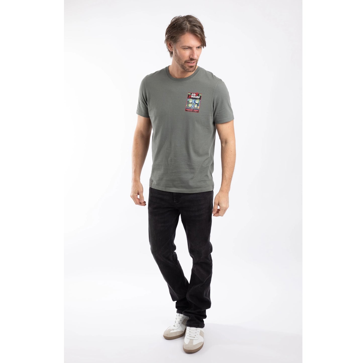 A man wearing a Weird Fish men's Cod Dwarf printed short sleeve t-shirt in Storm Grey with black  trousers.