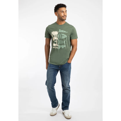 Man wearing a Deep Lichen Green colour short sleeve Weird Fish Double Fish t-shirt with a fishbones print and blue jeans on a white background