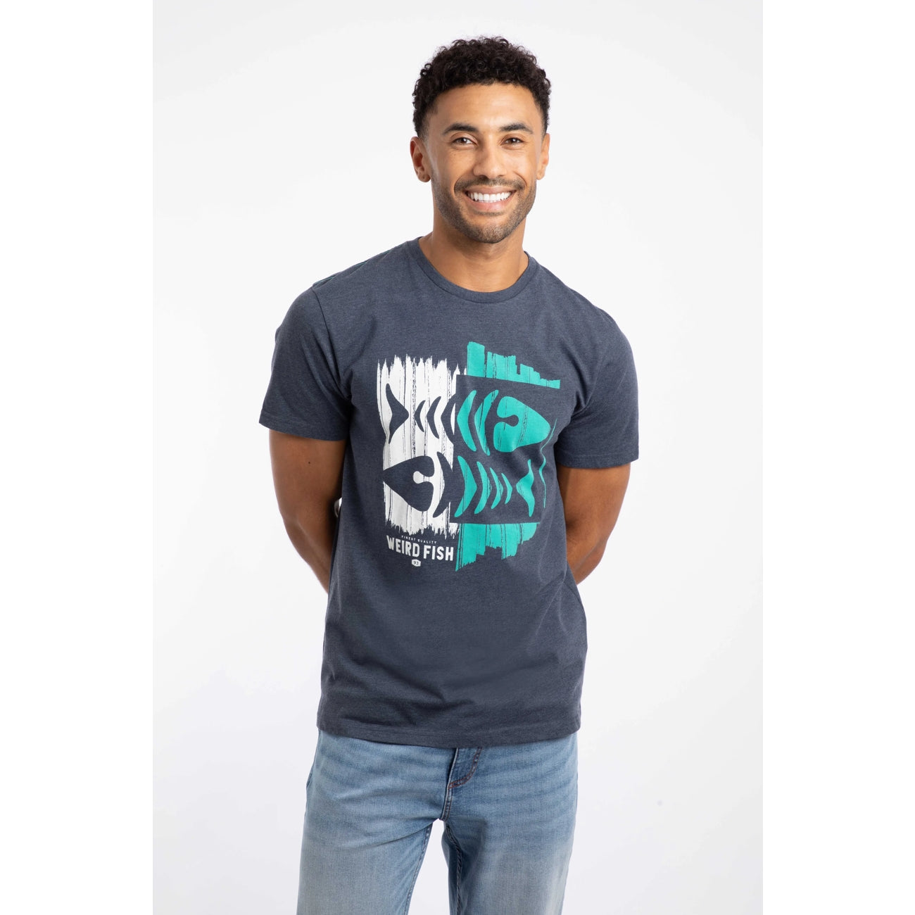 Front view of a man wearing a Weird Fish Double Fish short sleeve crew neck t-shirt in Navy with a distressed style fishbones print on a white background