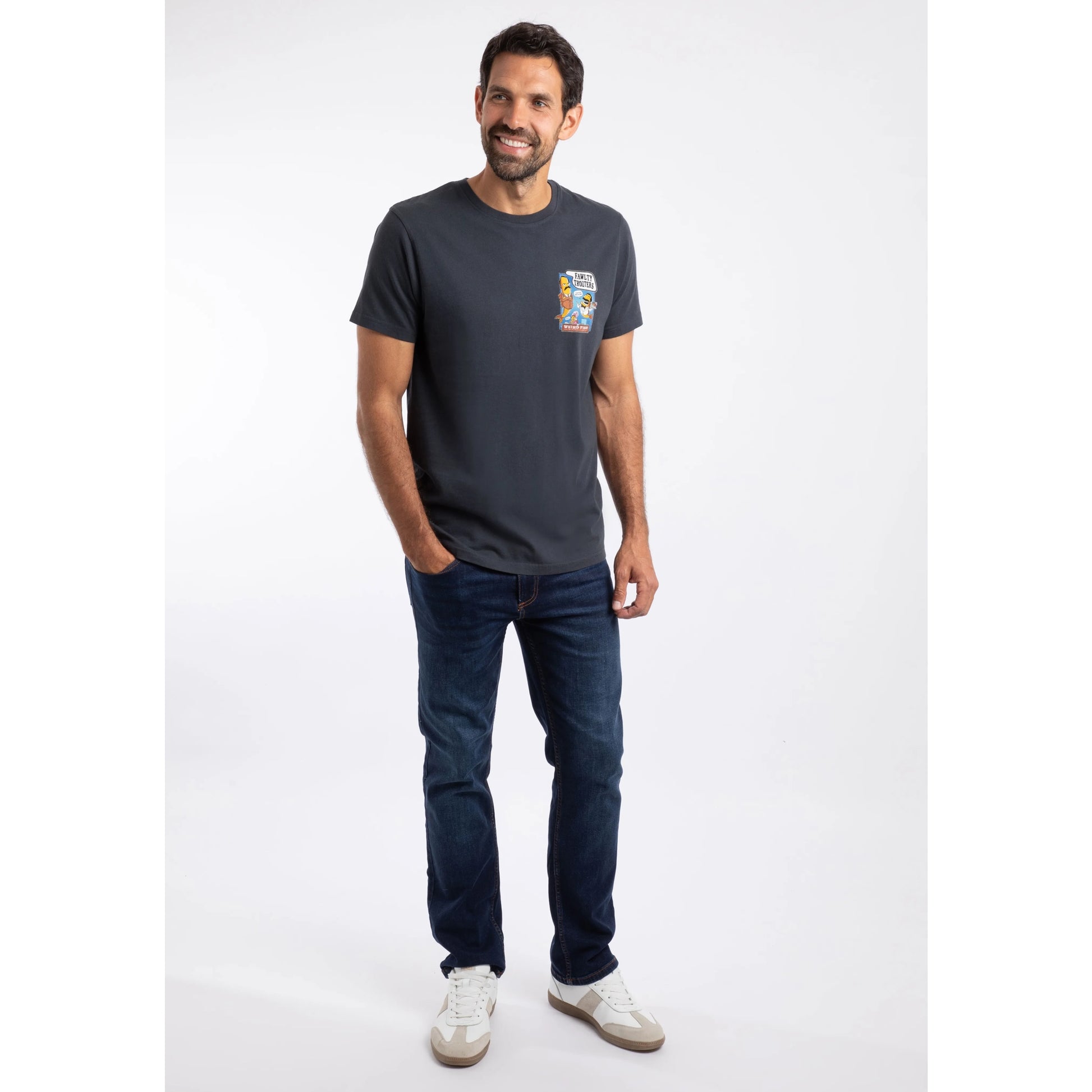 Man wearing Weird Fish mens Fawlty Trouters T-Shirt Navy with graphic print and casual jeans