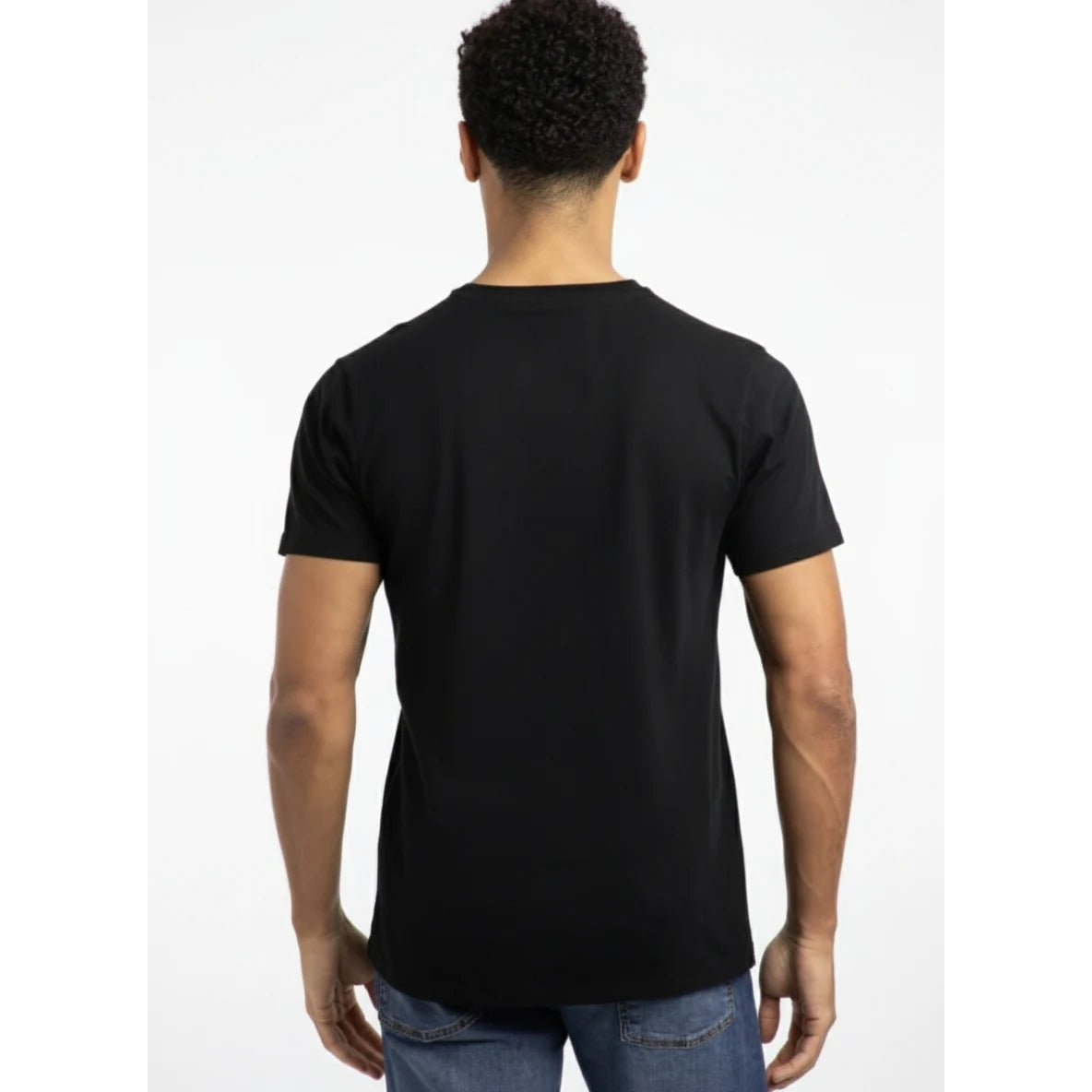 Back view of a man wearing a Weird Fish short sleeve Fished t-shirt in black with a small orange logo on the chest.