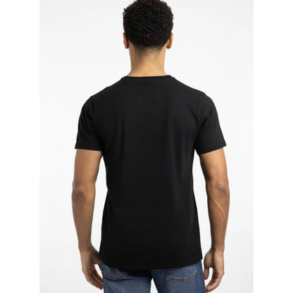 Back view of a man wearing a Weird Fish short sleeve Fished t-shirt in black with a small orange logo on the chest.