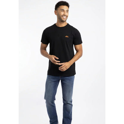 A man wearing a Weird Fish short sleeve Fished t-shirt in black with a small orange logo on the chest with blue jeans.