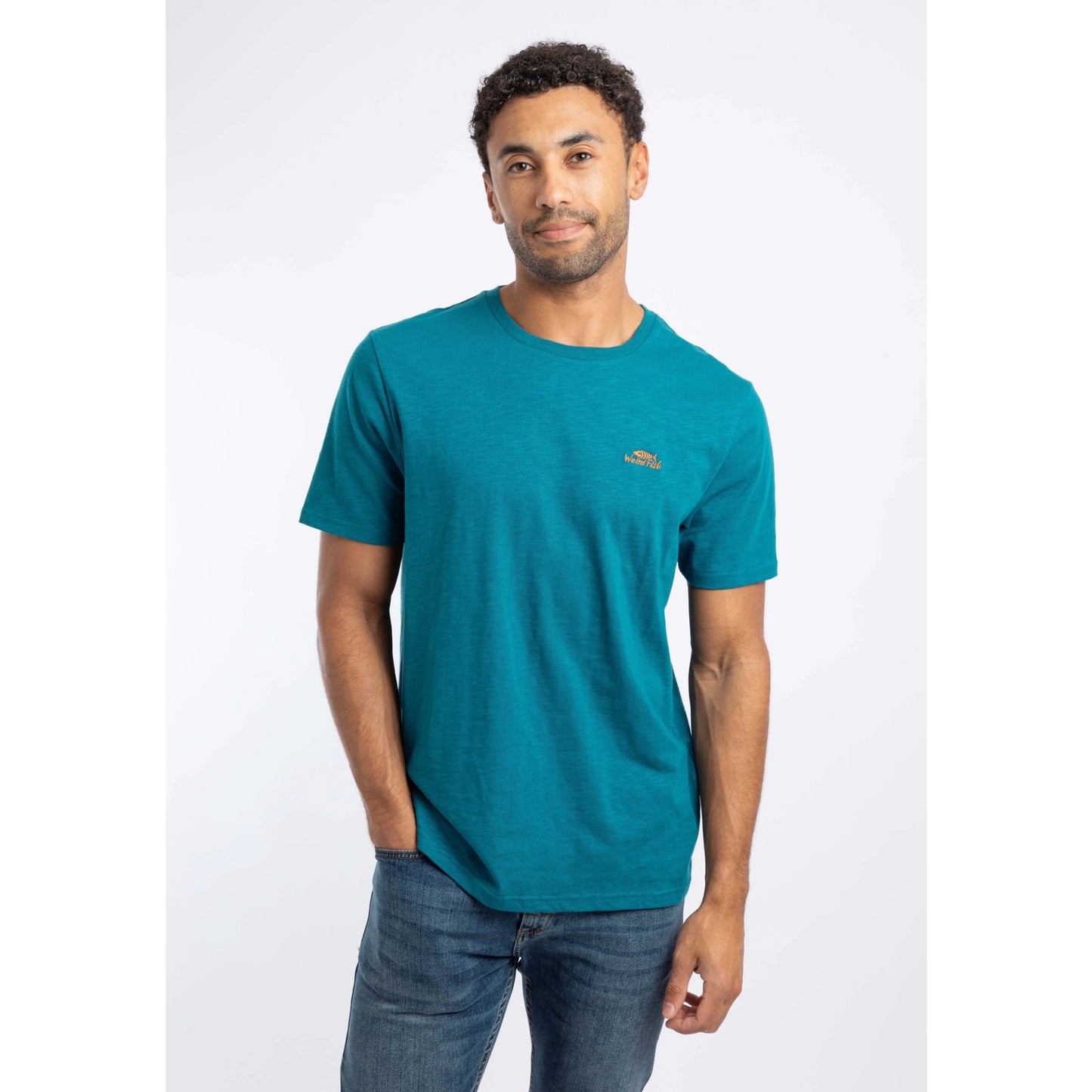 Front view of a man wearing a Weird Fish crew neck short sleeve Fished t-shirt in Blue Teal with small logo on one side of the chest.