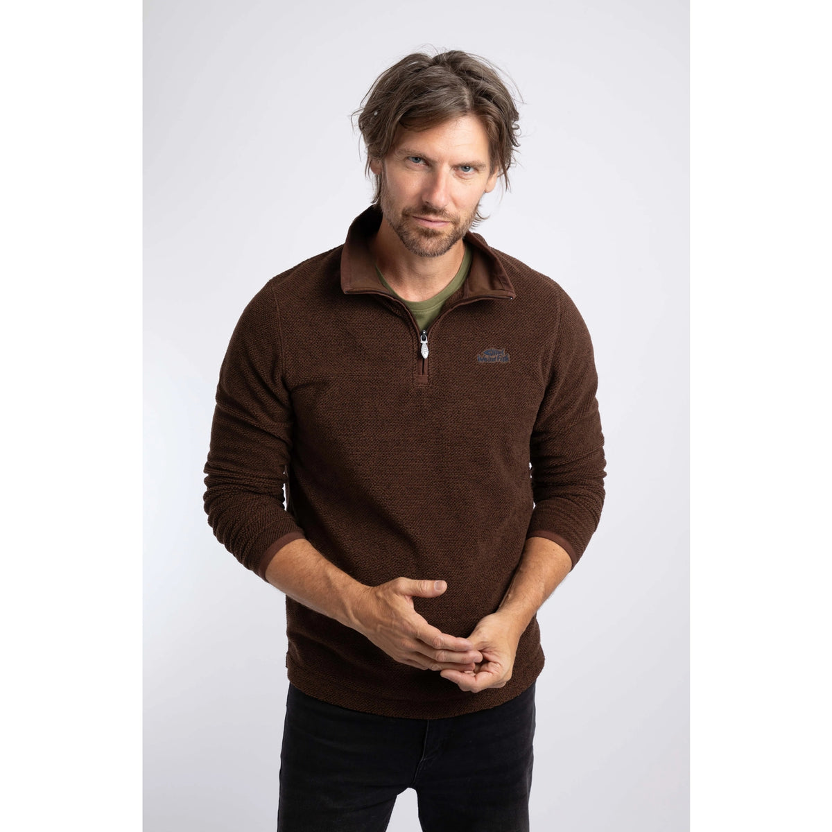 Front view of a man wearing a Weird Fish quarter zip textured Errill fleece in Chocolate brown.