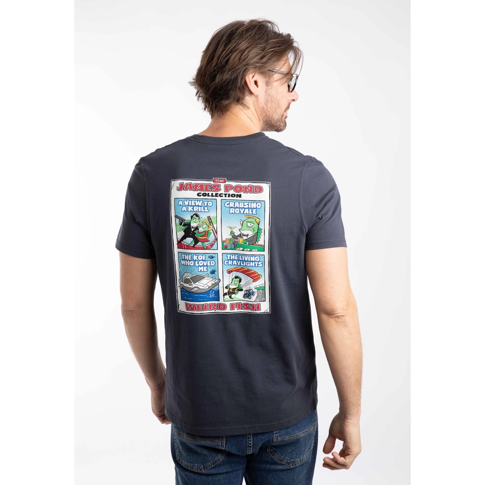 Back view of a man wearing a Weird Fish short sleeve James Pond printed t-shirt in Navy