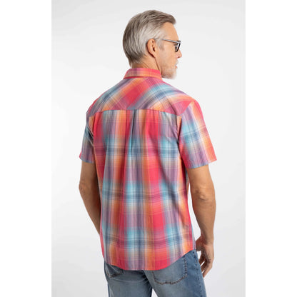 Back view of a man wearing a Weird Fish short sleeve Judd shirt in a bright Flamingo Pink, blue and orange check pattern with blue jeans.
