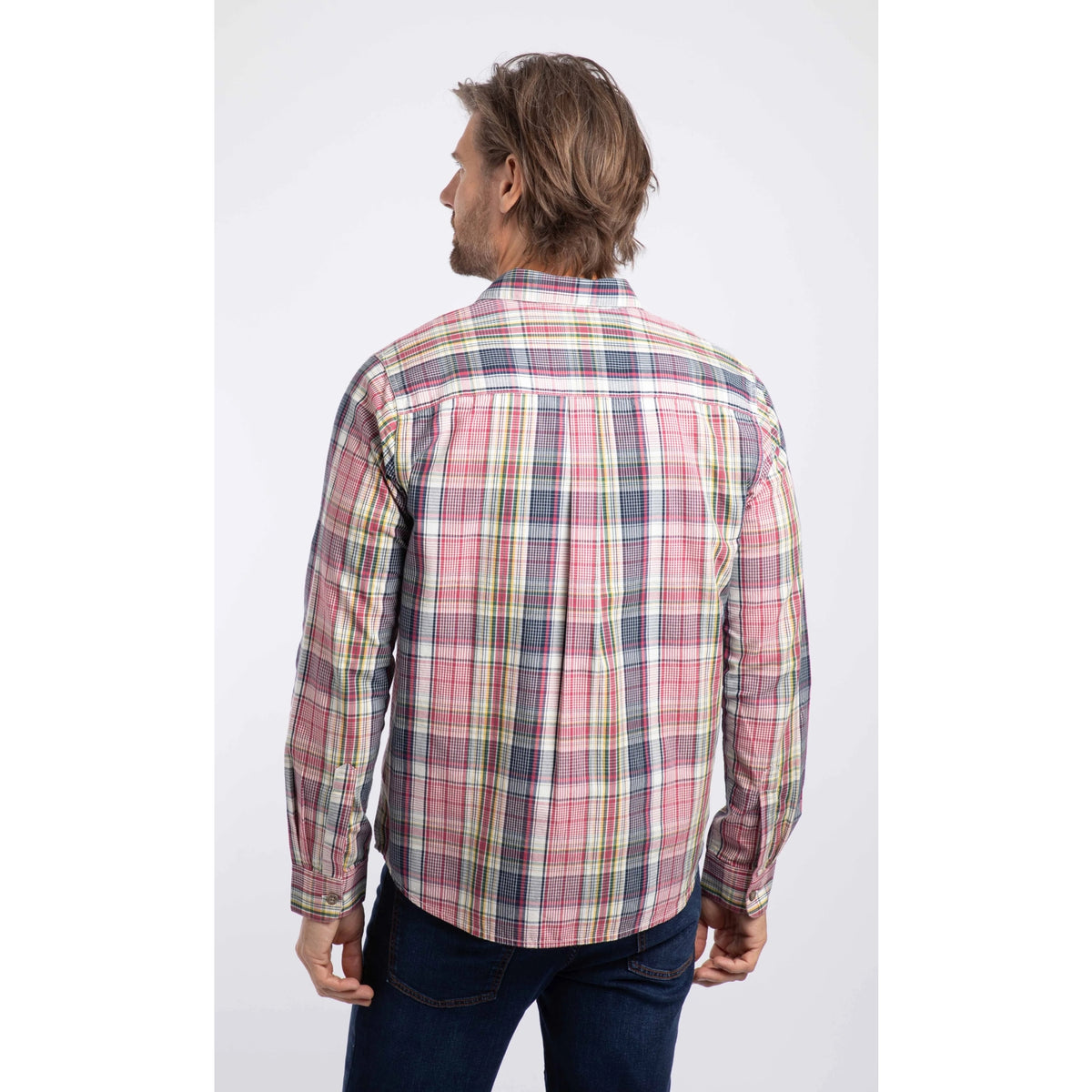Back view of a man wearing a Weird Fish long sleeve Lando shirt, in a crushed berry, navy, yellow and white check pattern.