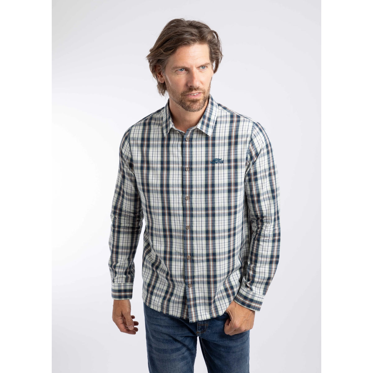 Front view of a man wearing a Weird Fish long sleeve Lando shirt, in Off White with a navy, green and orange check pattern.