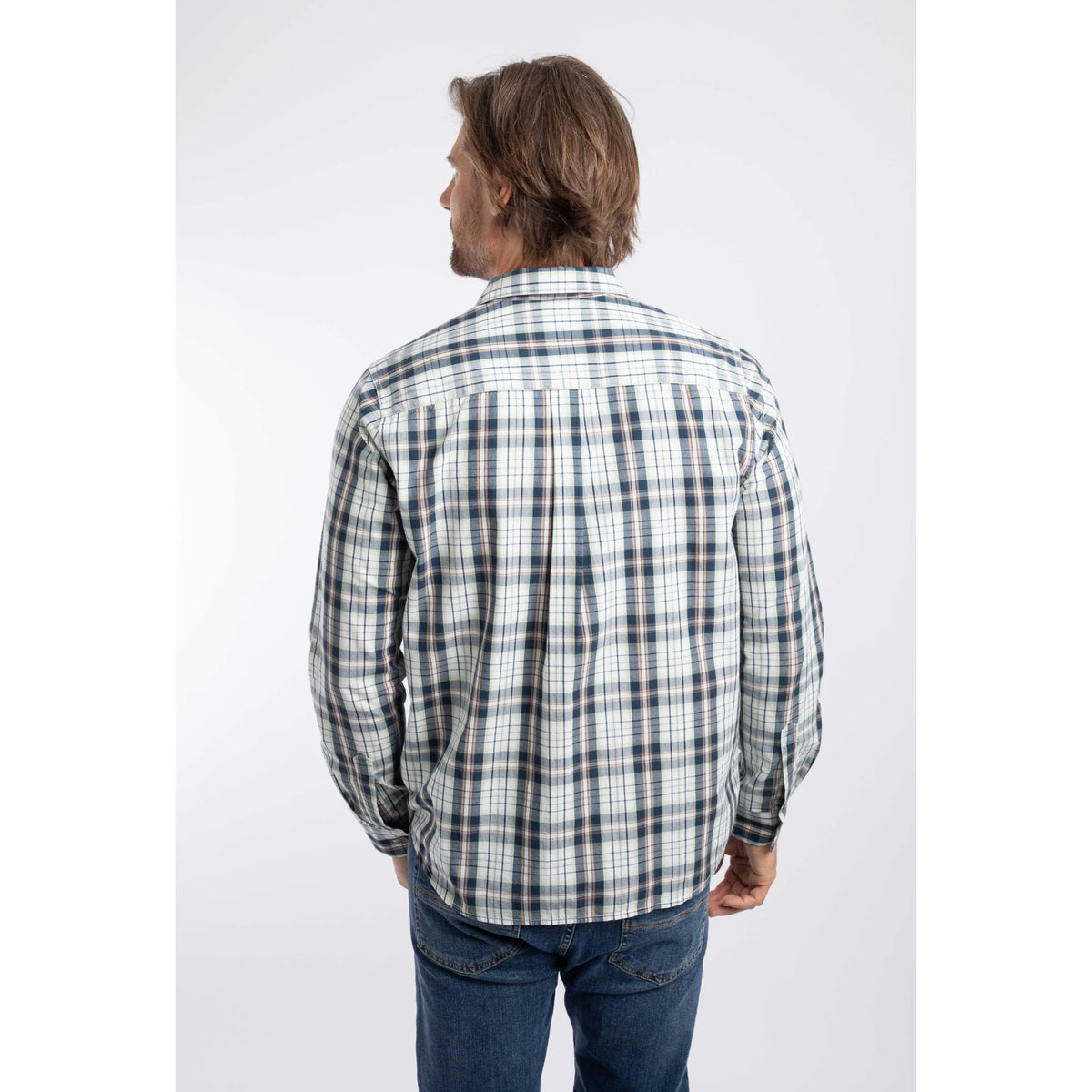 Back view of a man wearing a Weird Fish long sleeve Lando shirt, in Off White with a navy, green and orange check pattern.