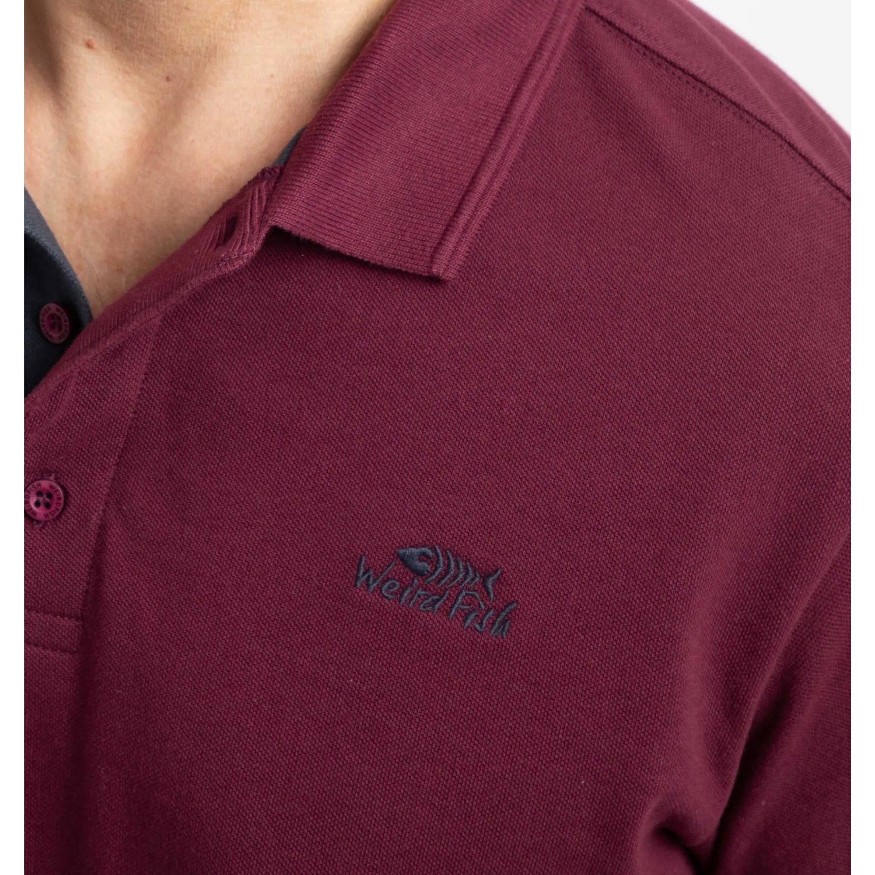 Maroon Weird Fish men's Miles polo shirt with a logo on the chest against a white background