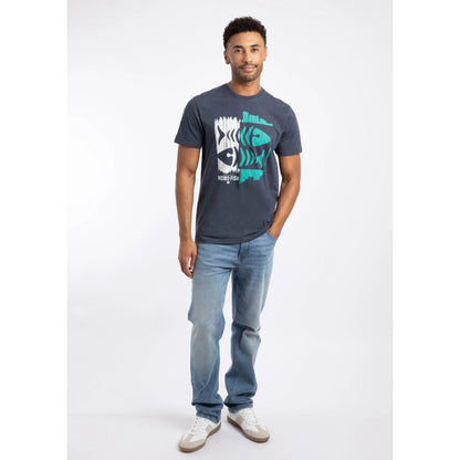 Man wearing a Weird Fish short sleeve navy Double Fish fishbones print tee with blue jeans on a white background