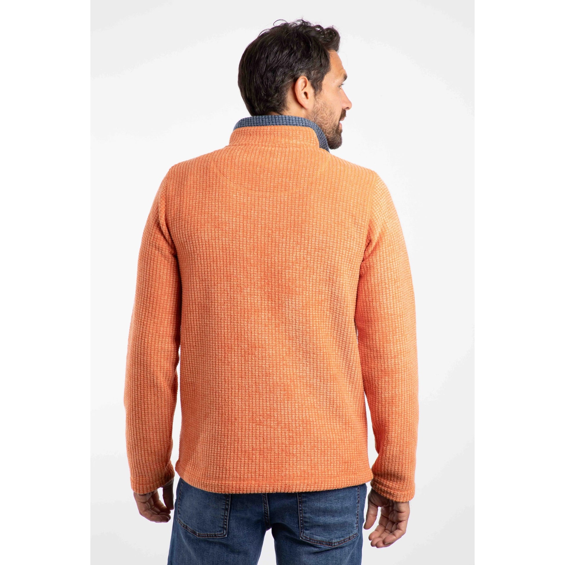 Weird Fish mens Newark grid fleece in Brick Orange shown from the back on a male model wearing jeans