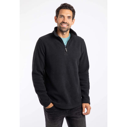 Man wearing a Weird Fish black quarter-zip Newport fleece on a white background