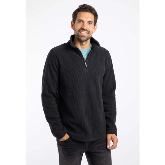 Man wearing a Weird Fish black quarter-zip Newport fleece on a white background
