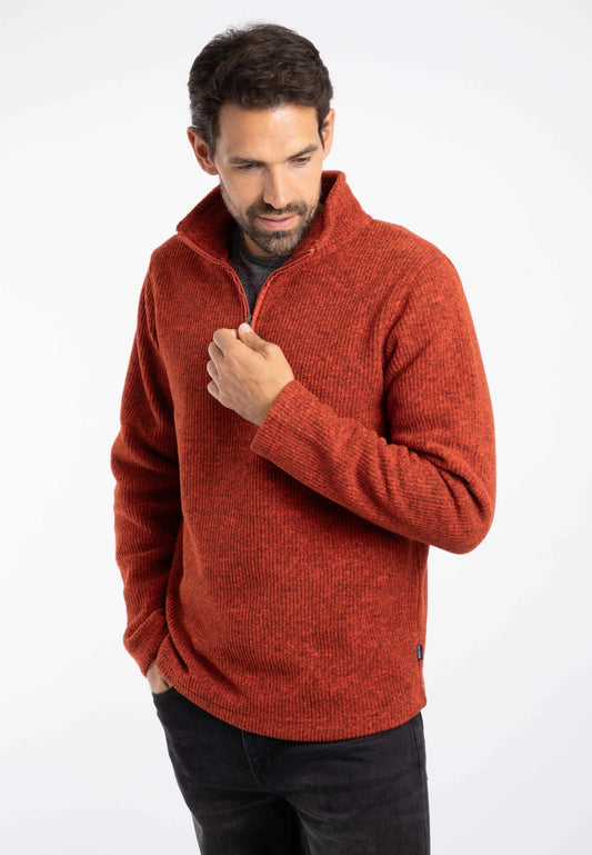 Main view of a man wearing a Weird Fish Newport orange rust colour fleece on a white background