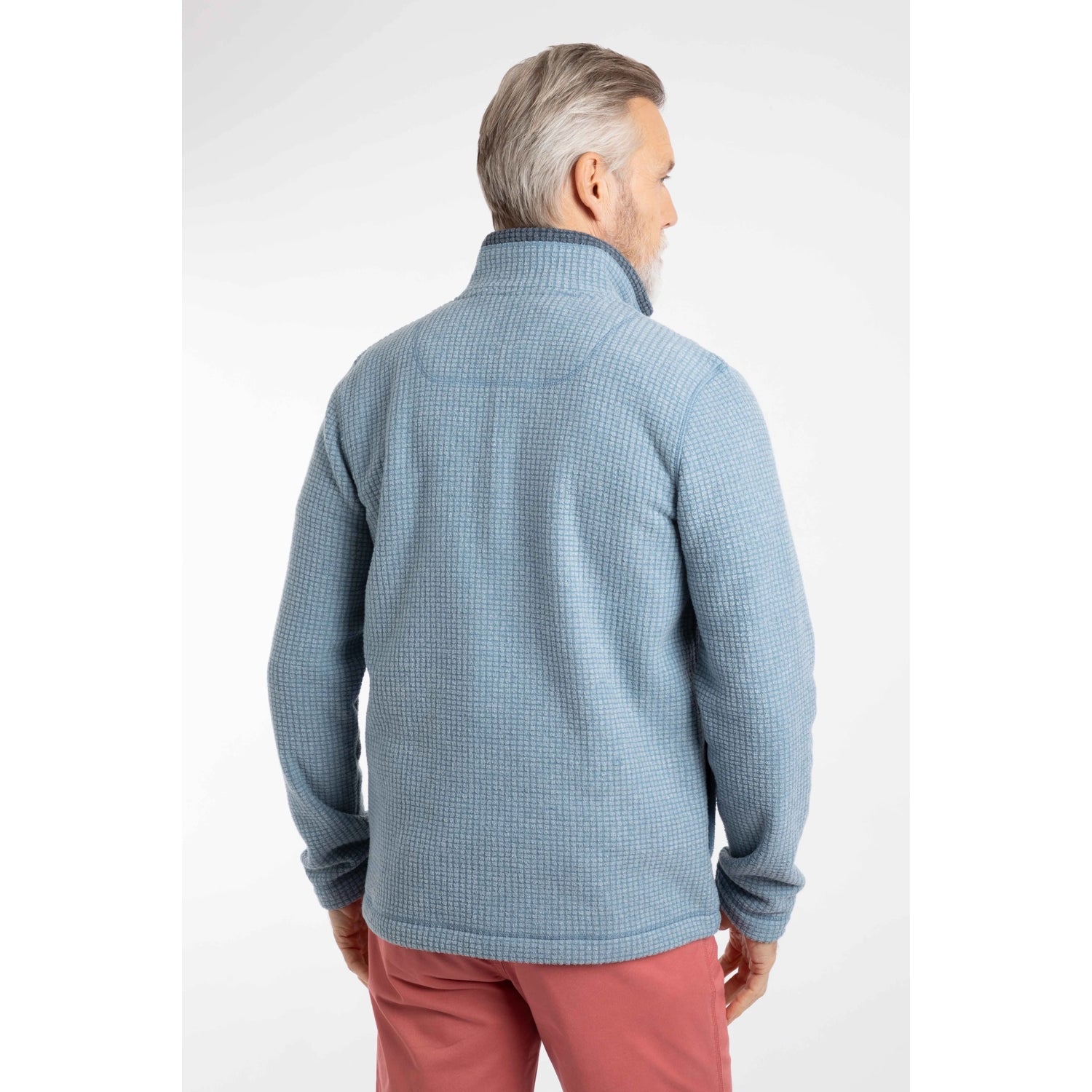 Back view of a man wearing a Weird Fish full zip Shires grid textured fleece in Light Blue with contrasting navy neckline with pink shorts