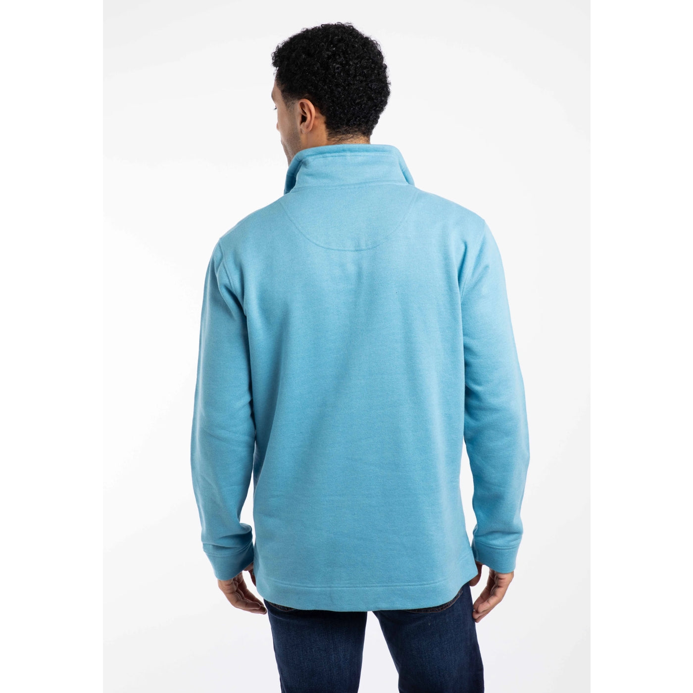 Back view of a man wearing a light blue Weird Fish sweatshirt on a white background