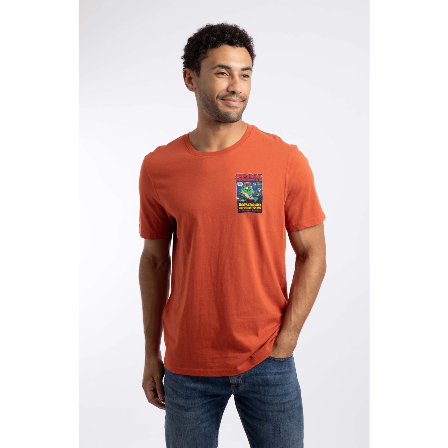 Front view of a man wearing a Weird Fish Space Coddity printed t-shirt in a Rust Leaves shade of orange.