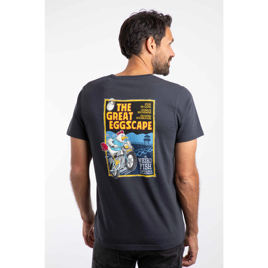 Man wearing a navy t-shirt with a colorful graphic on the back, set against a white background
