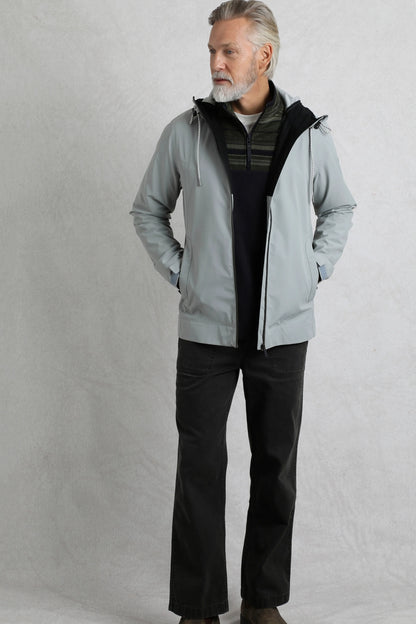 Weird Fish mens waterproof jacket grey worn by man with hands in pockets